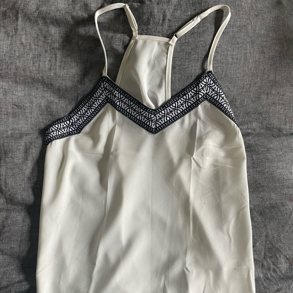 White razor back tank with black embroidery